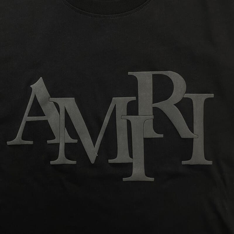 Amiri Staggered Logo Black T-Shirt - FetchStyles